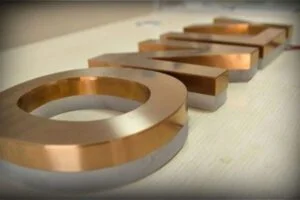 enseigne relief bronze